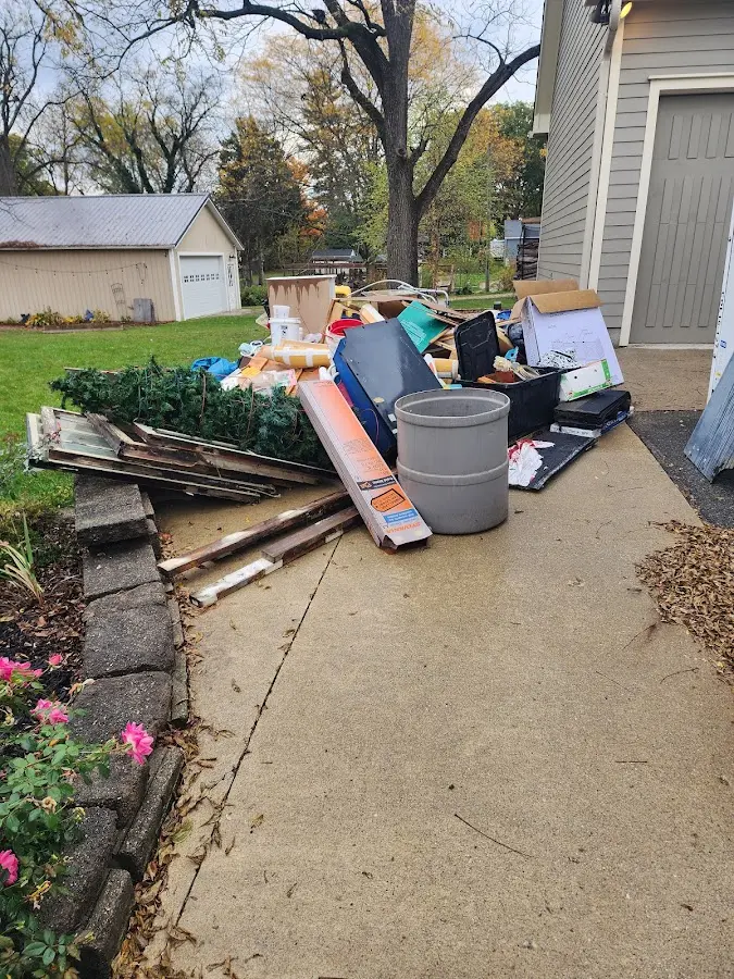 Dumpster being loaded with debris for Commercial Dumpster Rental in Decatur